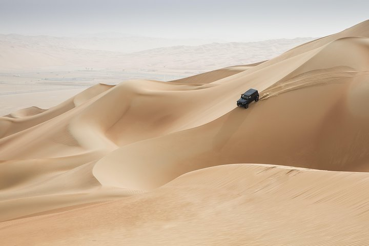 Experience the magic of the Abu Dhabi desert where the sand dunes invite adventure through dune bashing and exploration creating lasting memories under the endless sky.